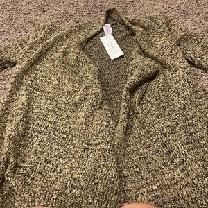 3/$30. Mixed color cardigan sweater.